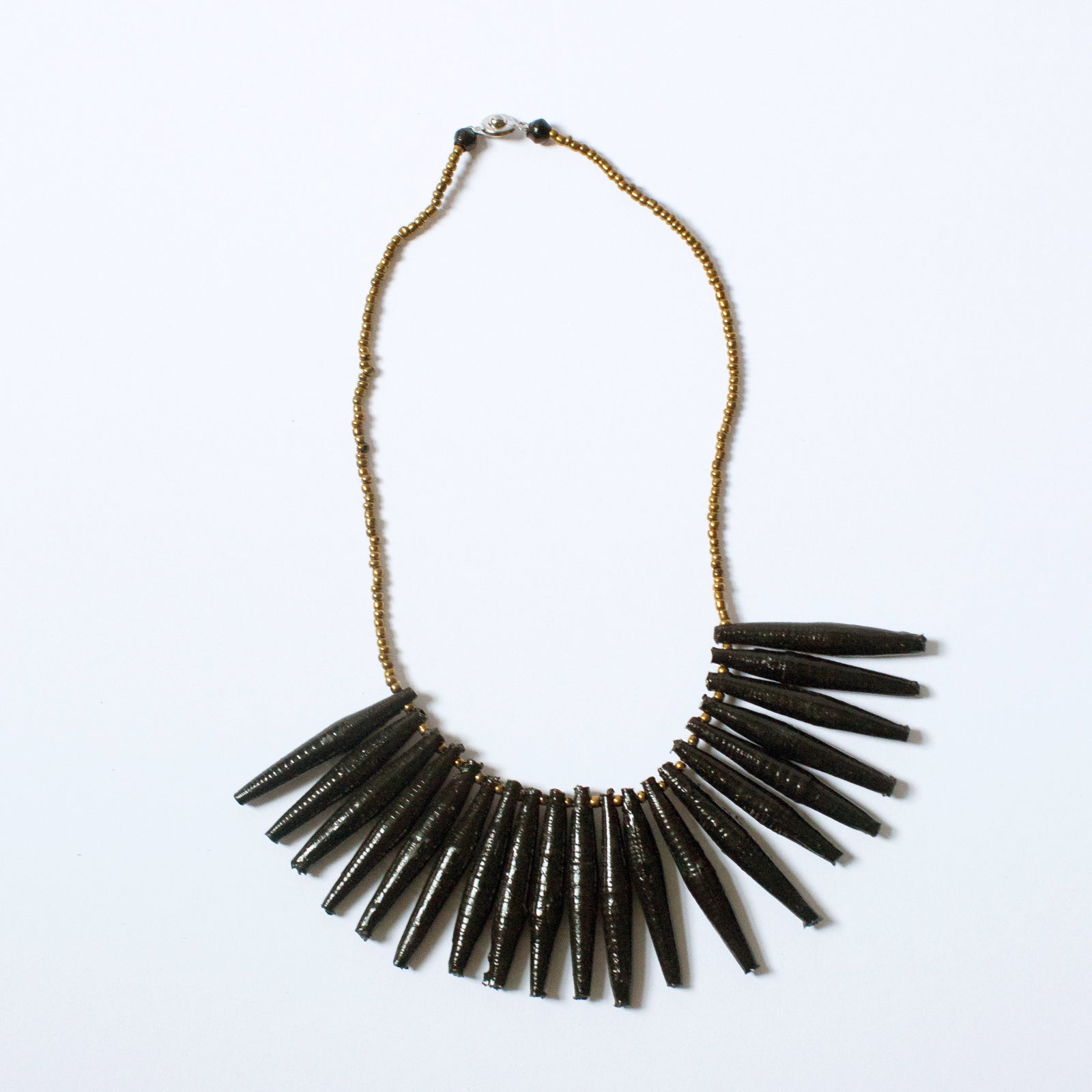 JustOne's necklace with long black paper beads dangling off, handcrafted in Uganda