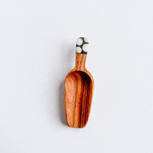 JustOne's four inch wooden scoop with polka dot handle made from ethically sourced bone, handcrafted in Uganda