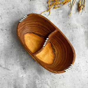JustOne's oval wooden bowl with a piece of wood in the middle to create two sections, handmade in Kenya